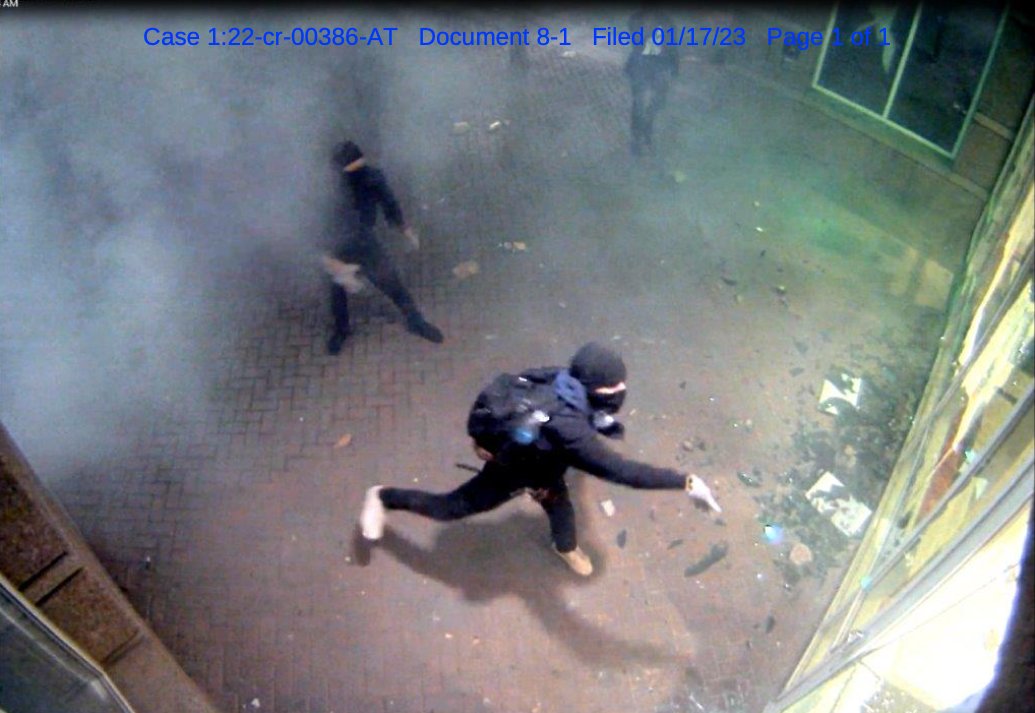 Hunsinger in black bloc clothing during the attack